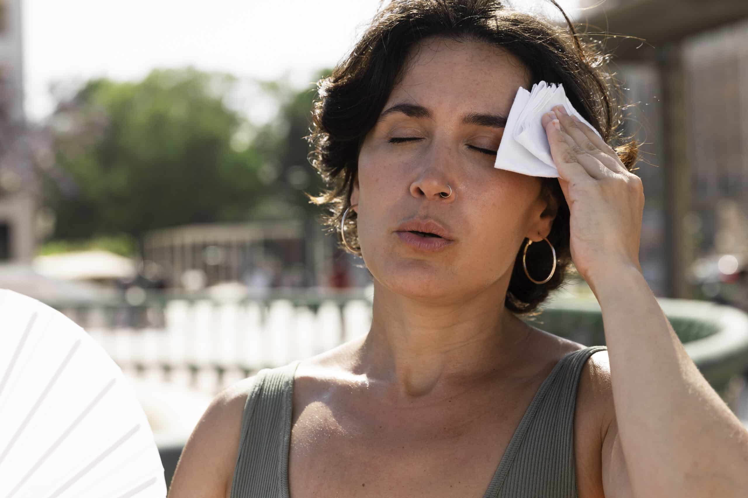 woman struggling with high temperature
