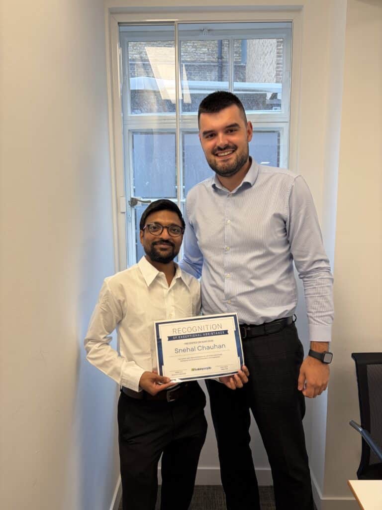 Photo of Snehal receiving Fusion People's Recognition of Exceptional Assistance award